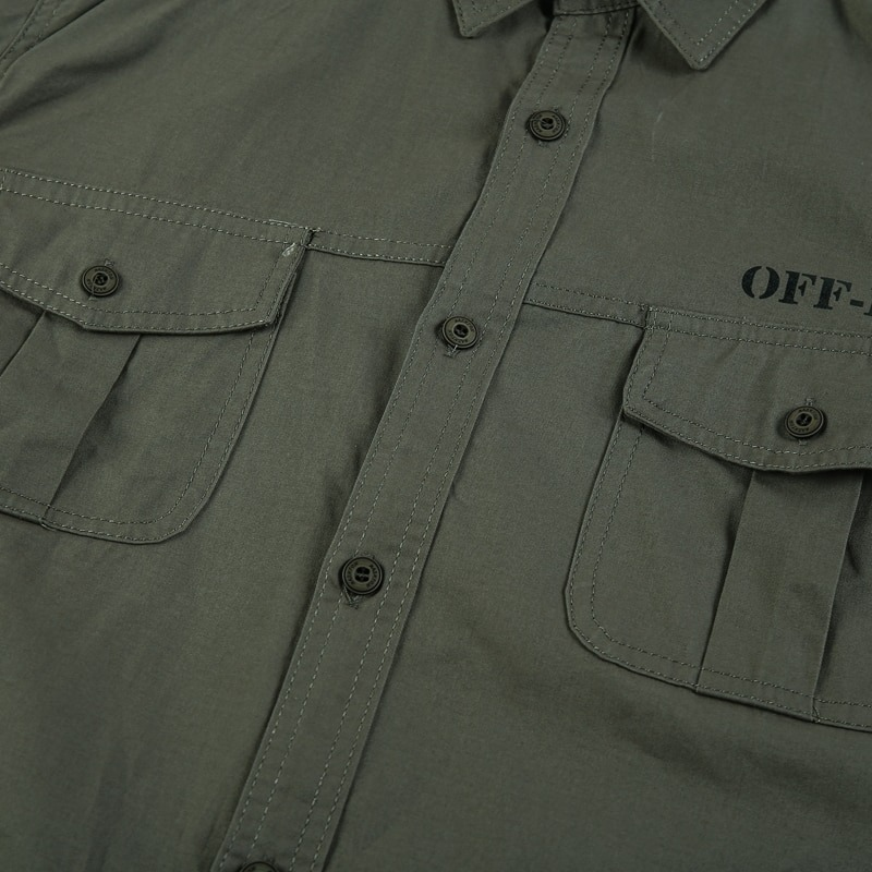 Stylish men’s military style long sleeve cotton shirt with button details and pockets in army green.