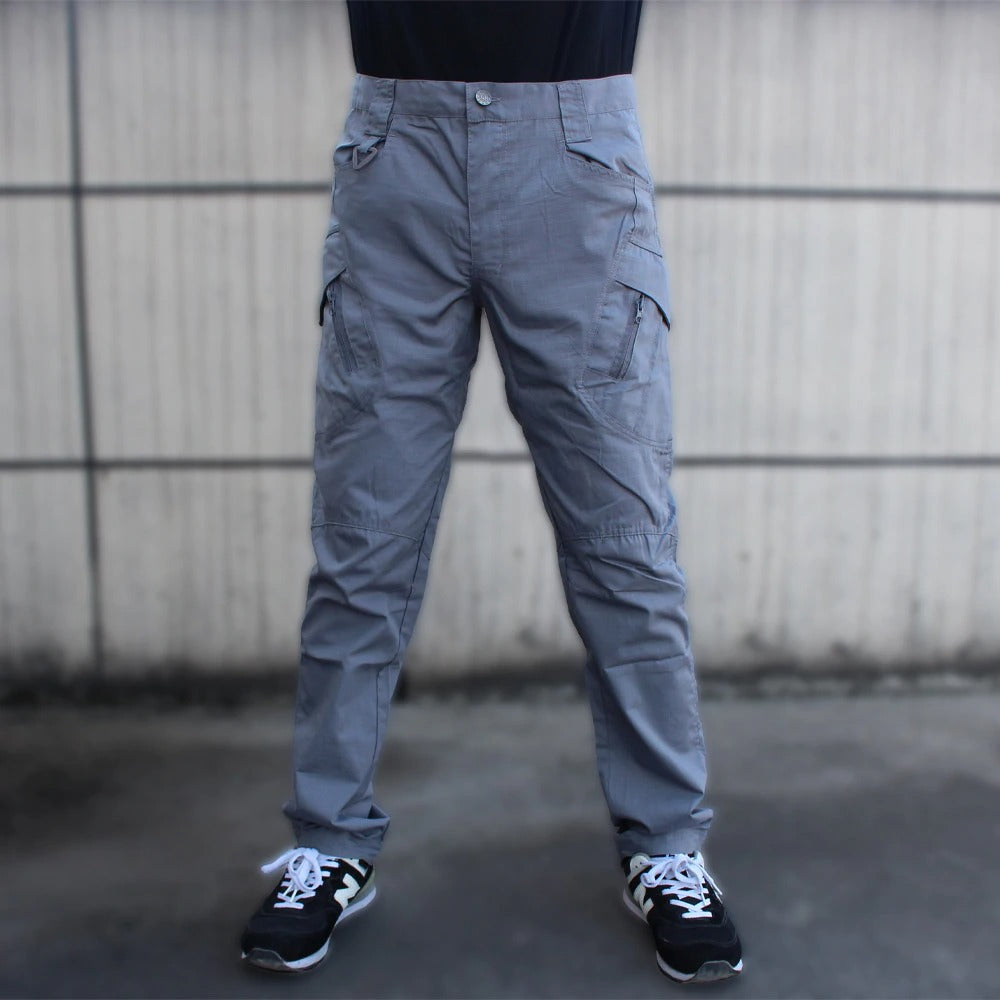 Men's military tactical cargo pants in gray, featuring multiple pockets for functionality and comfort.