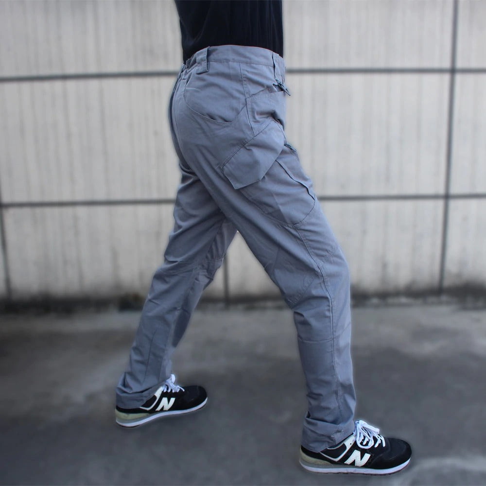 Gray military tactical cargo pants with multiple pockets, perfect for outdoor activities and versatile style.