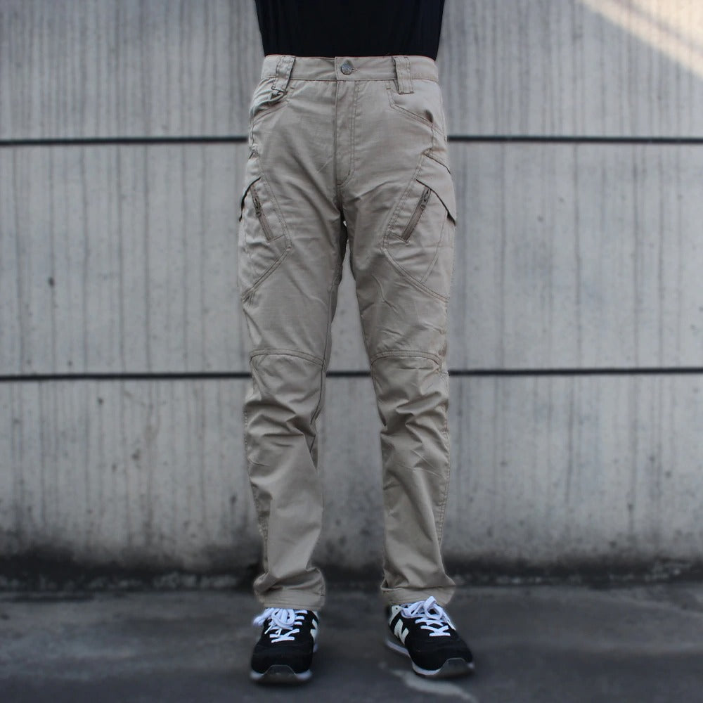 Men's military tactical cargo pants in khaki with multiple pockets, perfect for outdoor activities and stylish layering.