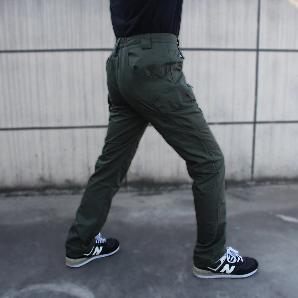 Men's military tactical cargo pants in green, showcasing multi pockets and a stylish fit, perfect for outdoor activities.