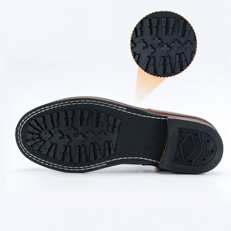 Sole of mixed-color men's retro lace-up boots showcasing durable tread pattern for traction.