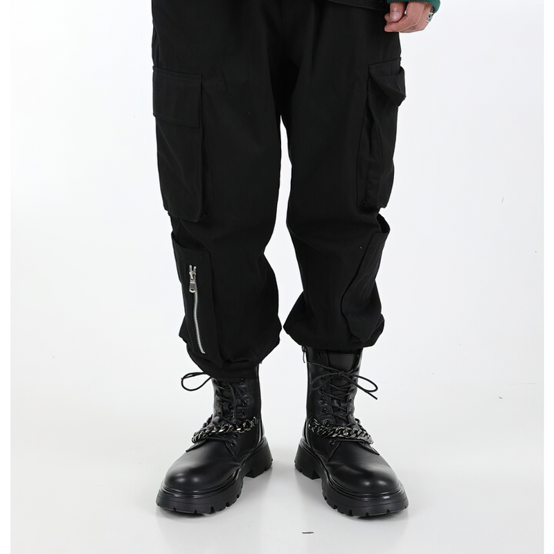 Men's punk motorcycle boots with metal chain and thick soles, paired with black cargo pants.