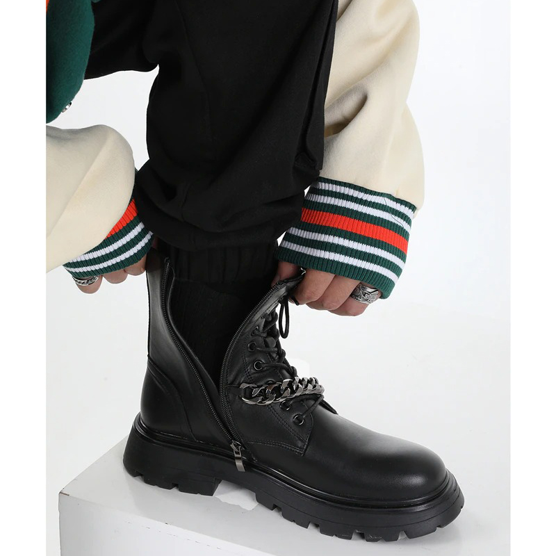 Men's black motorcycle boots with metal chain and thick sole, perfect for a punk fashion style.