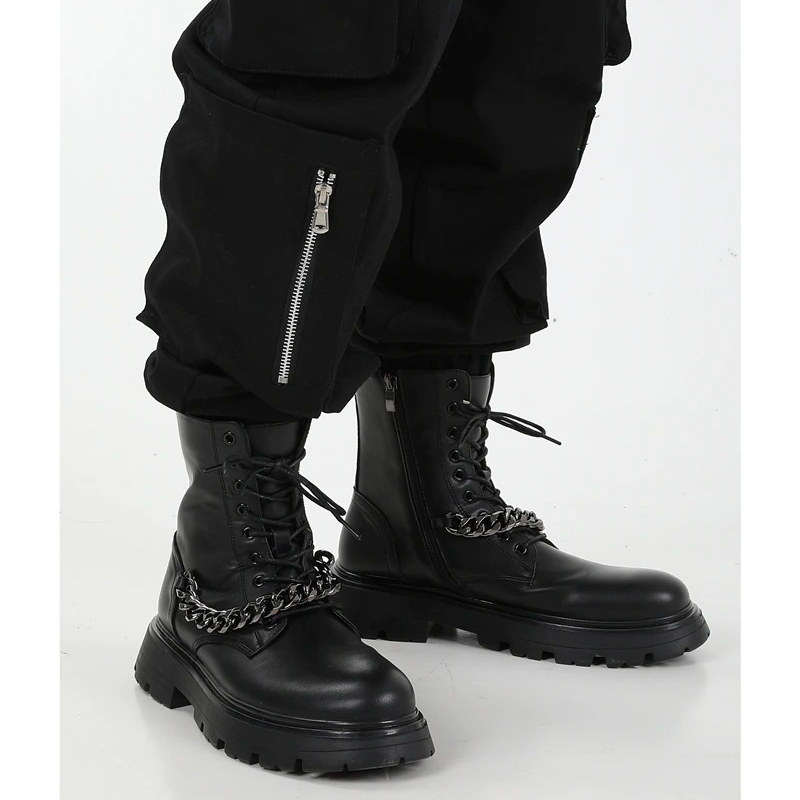 Men's motorcycle boots with metal chain detail, thick sole for comfort, stylish lace-up design in black.