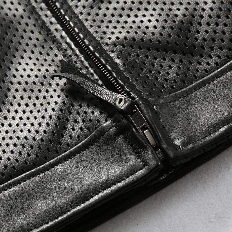 Close-up of breathable mesh biker vest zipper detail in black cowhide leather for alternative fashion.
