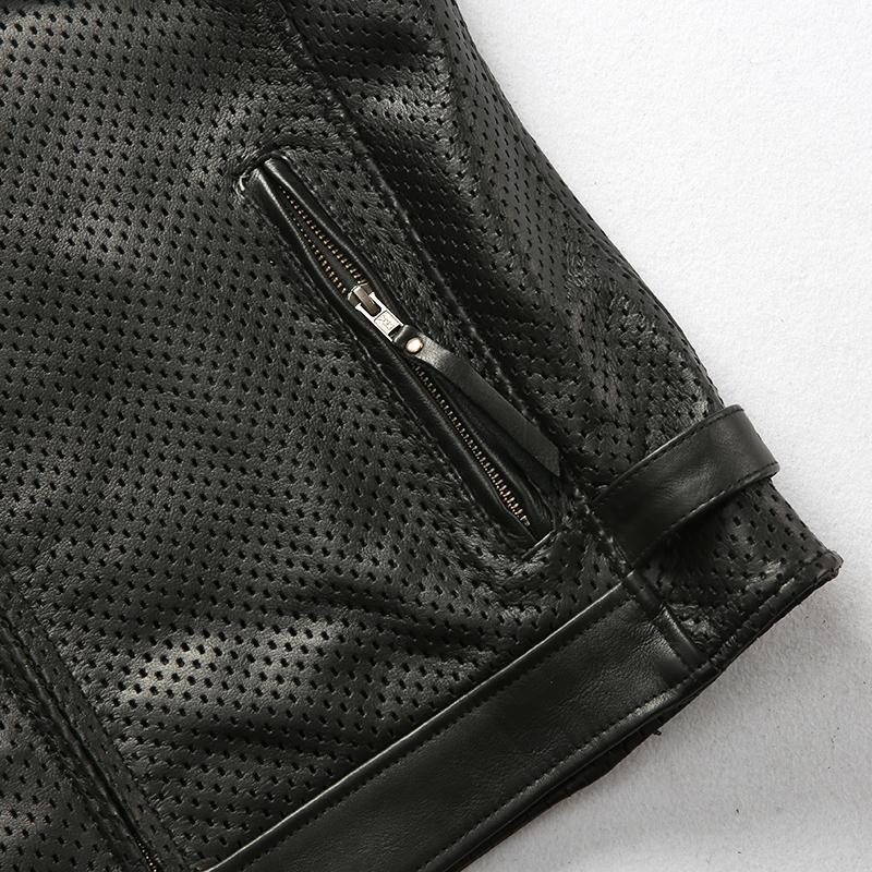 Close-up of biker vest featuring breathable mesh cowhide, zipper pocket, perfect for alternative fashion outfits.