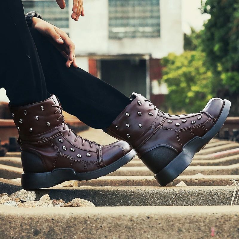 Men's genuine leather motorcycle boots with gothic skulls and silver rivets, perfect for a stylish casual look.