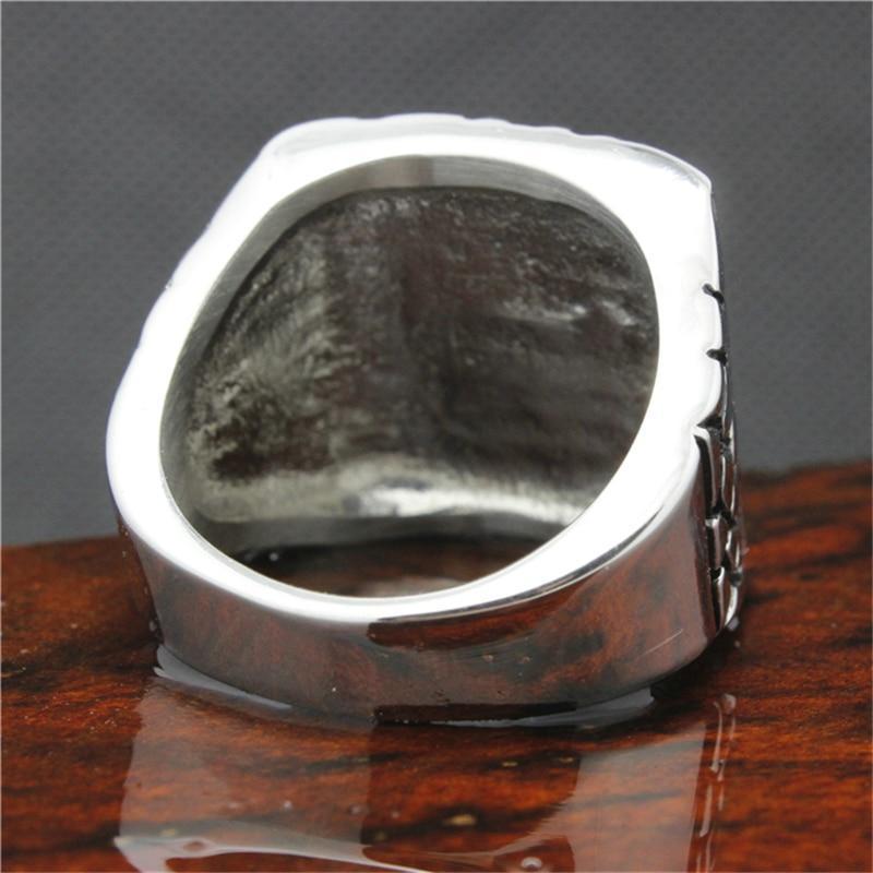 Close-up view of a stainless steel motorcycle biker ring showcasing its inner design and shine.