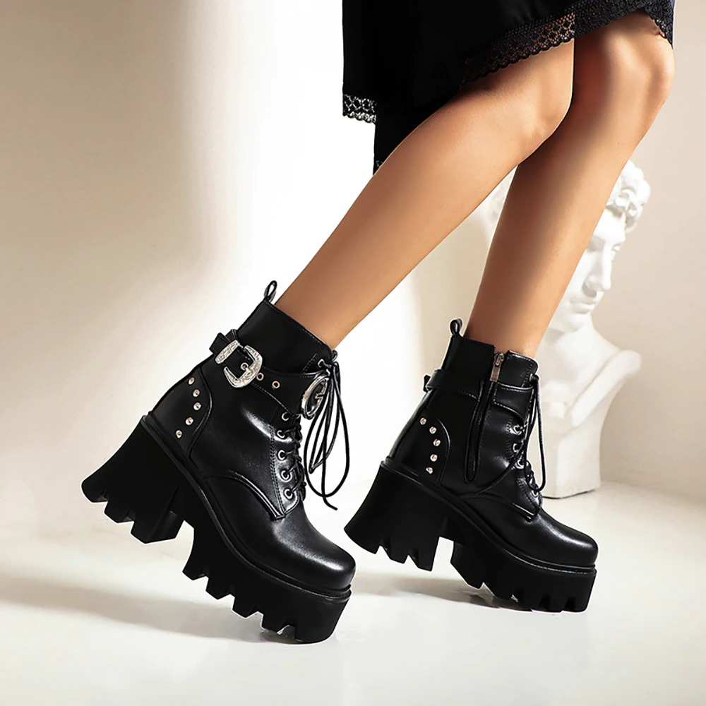 Stylish women's black ankle boots with metal buckle and high platform heel, perfect for casual wear.
