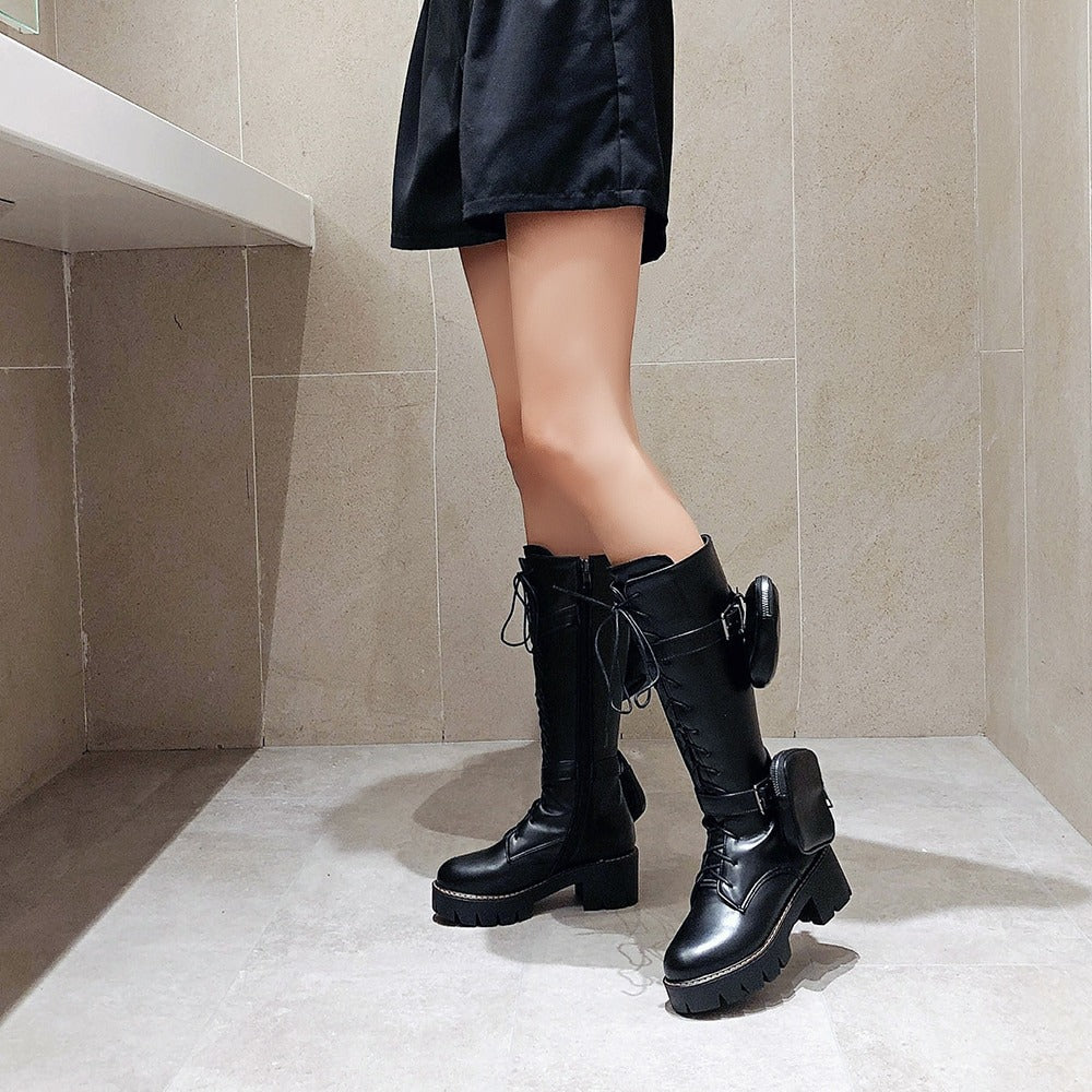 Stylish women's motorcycle boots with lacing, pocket detail, and thick sole, perfect for steampunk fashion.