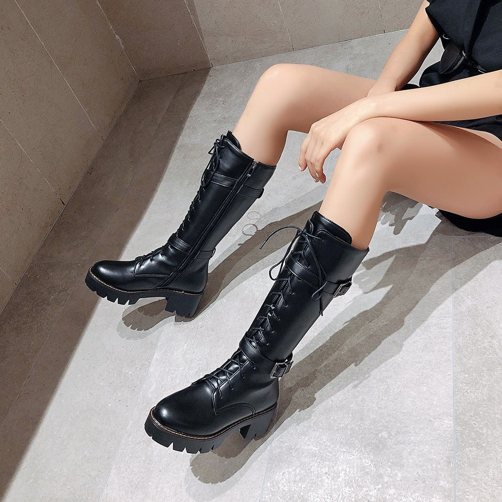 Women's gothic lace-up black motorcycle boots with a thick sole, stylish pocket detail, perfect for steampunk fashion.