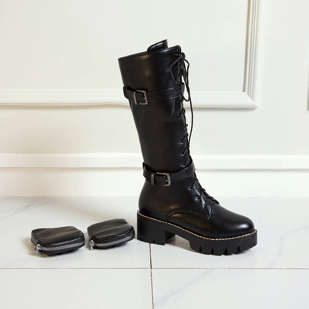Womens black lace-up platform motorcycle boots with thick sole and decorative pockets, perfect for steampunk fashion.