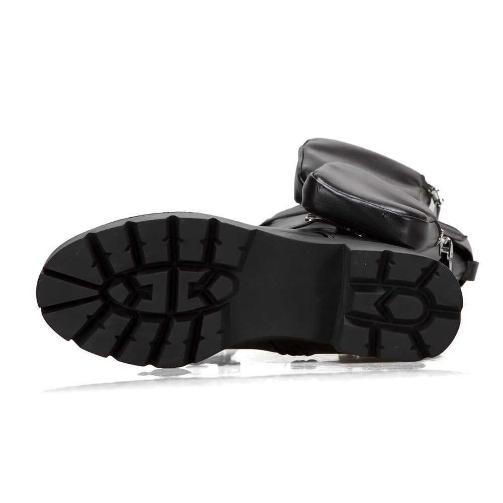 Sole of women's motorcycle boots showcasing thick tread and pocket detail, perfect for steampunk fashion and comfort.