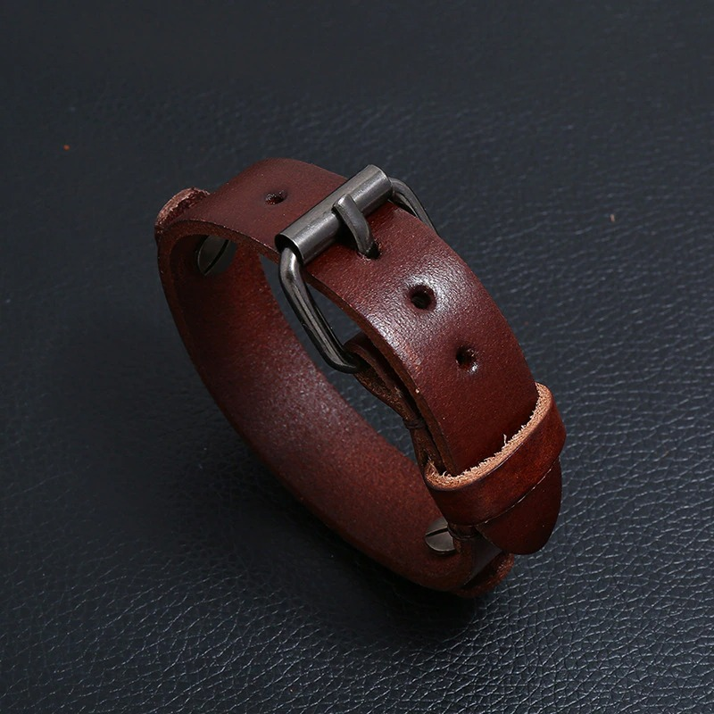 Multi-layer wide leather bracelet with silver buckle, adjustable punk style jewelry for casual wear.