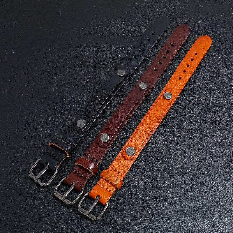 Multi-layer wide bracelet set in black, brown, and orange leather with silver buttons for punk style jewelry.