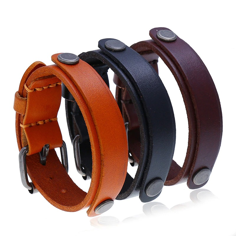 Multi-layer wide bracelet set in genuine leather, featuring adjustable styles for men and women. Perfect punk jewelry accessory.