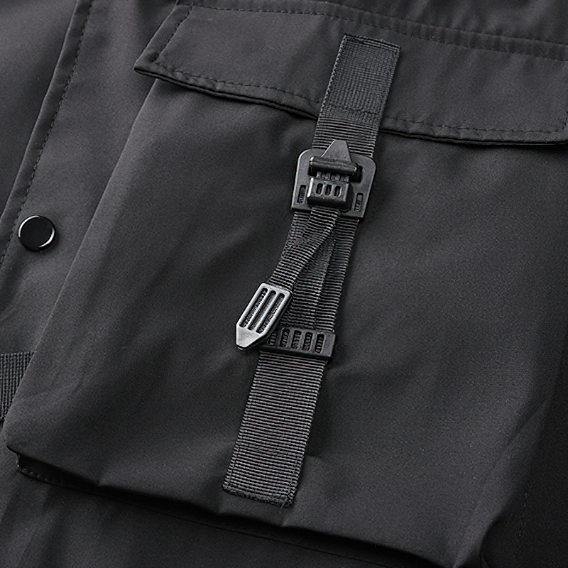 Close-up of a black multi-pocket bomber jacket showcasing its stylish buckle and pocket design for utility and comfort.