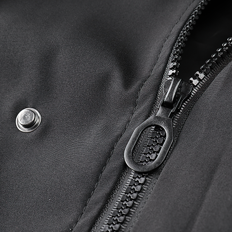 Close-up of the zipper and snap detail on a stylish black multi-pocket bomber jacket for men.