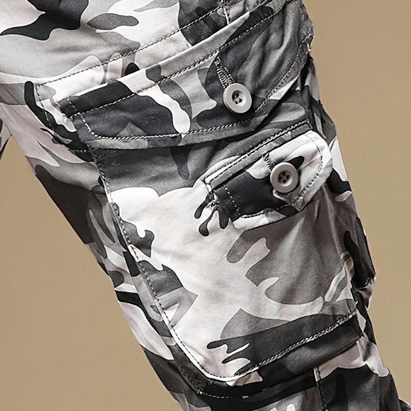 Men's slim-fit camouflage pants showcasing stylish pockets and trendy military design.
