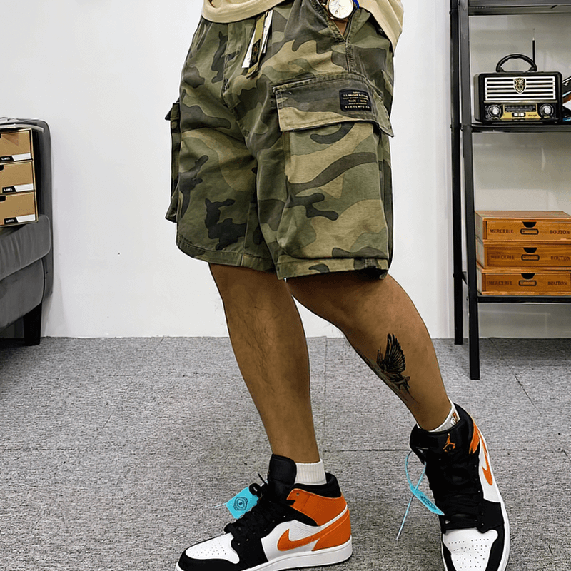 Men's camouflage cargo shorts in trendy alternative style, showcasing multi-pockets and cotton comfort, perfect for casual wear.