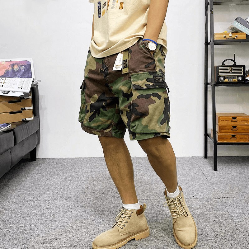 Men's multi-pocket camouflage cargo shorts showcasing a trendy alternative style, perfect for casual outings.