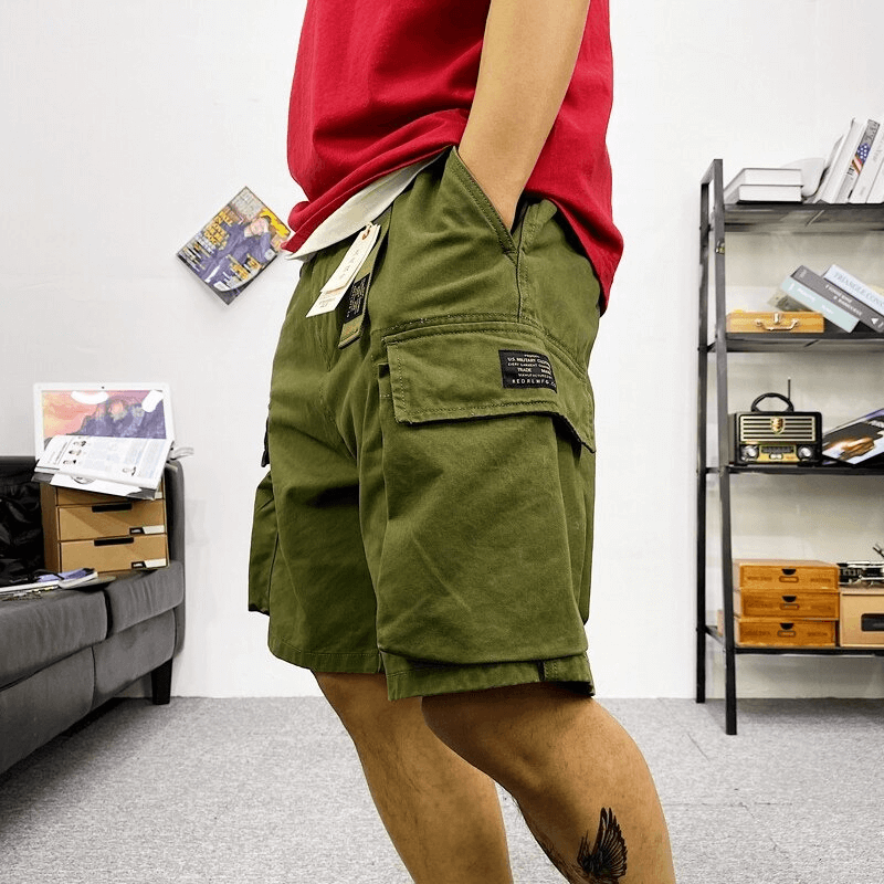 Men’s cotton camouflage cargo shorts, trendy alternative style, green color, side pockets, perfect for casual wear.