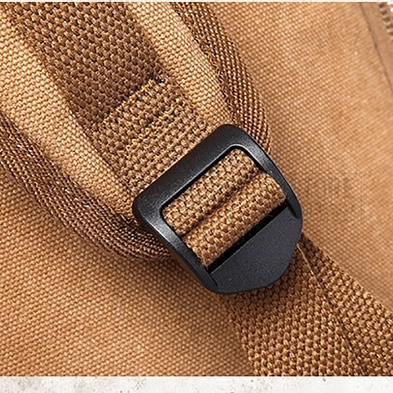 Close-up of sturdy buckle on a stylish unisex motorcycle backpack, showcasing quality craftsmanship and durability.
