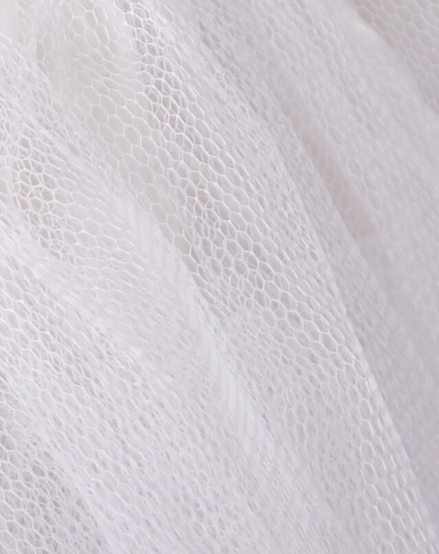 Close-up of multilayer mesh fabric in white, showcasing texture for women's gothic style mini skirt.