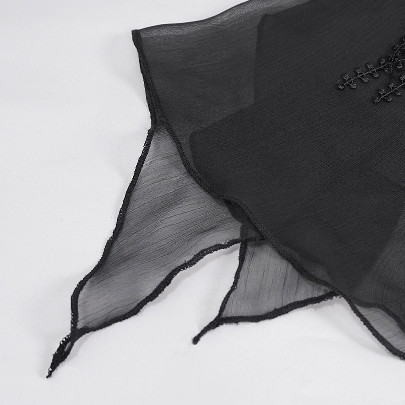 Close-up of sheer black chiffon fabric with lace detailing, perfect for a gothic style skirt accent.