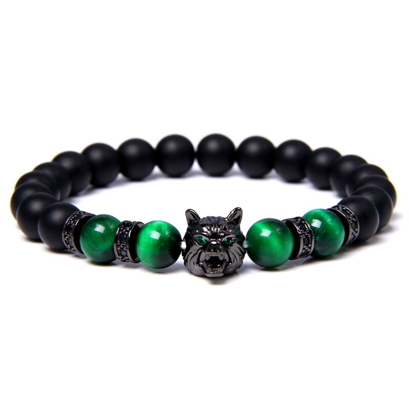 Natural black lava stone bracelet featuring a wolf charm and vibrant green beads in an alternative style.