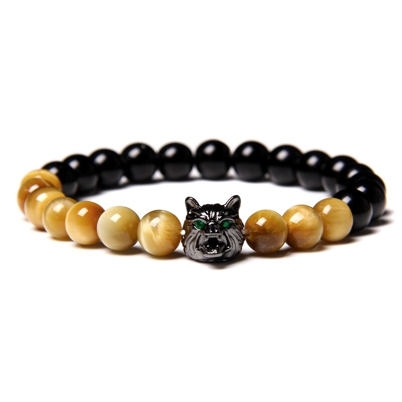 Natural black lava stone bracelet with wolf charm and unique colored beads, perfect for alternative jewelry lovers.