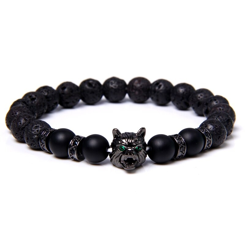 Natural black lava stone bracelet with wolf charm and unique color beads for alternative jewelry lovers.