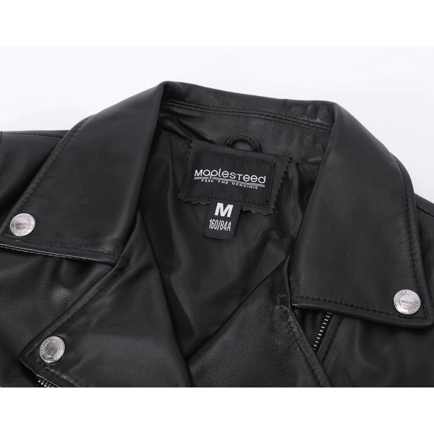 Interior view of sheepskin leather jacket showing label and classic rock style, perfect for women's fashion.