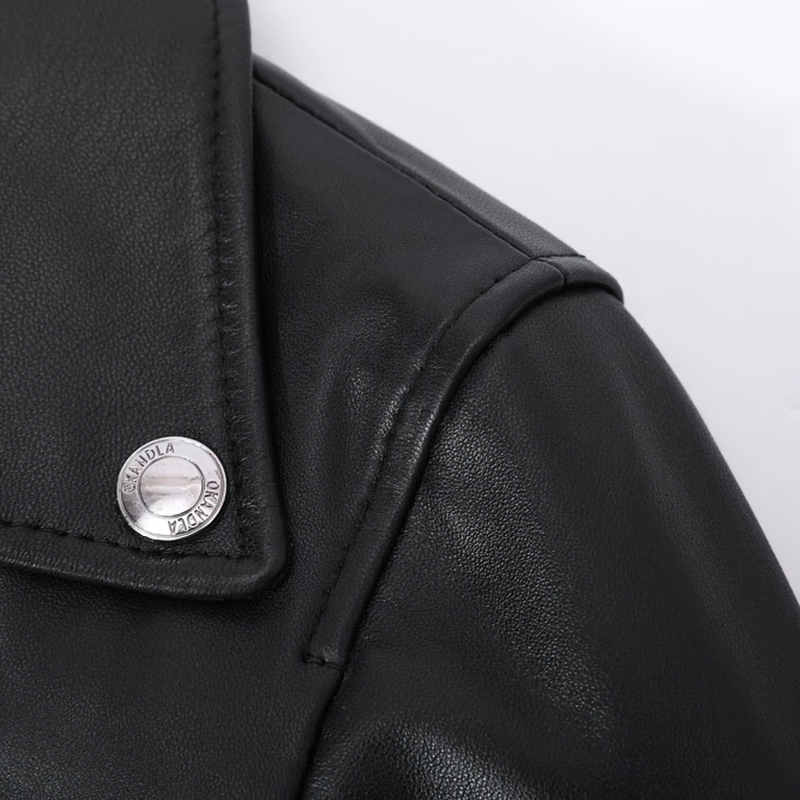 Close-up of a stylish women's sheepskin leather jacket showcasing its sleek collar and silver snap button detail.