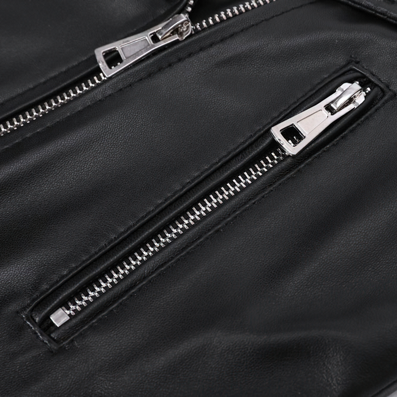 Close-up of stylish black leather jacket zippers, showcasing silver details for a chic rock fashion look.