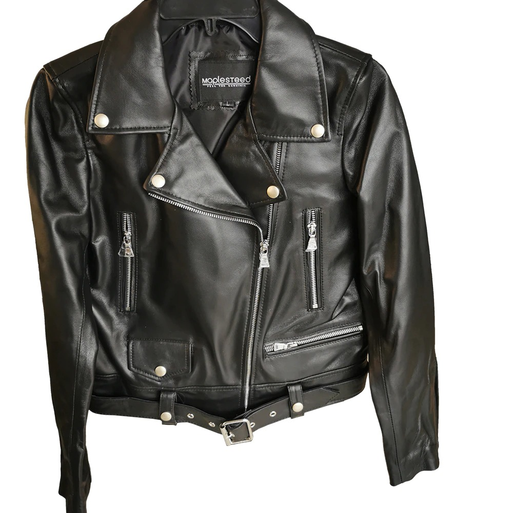 Stylish women's black sheepskin leather jacket with silver zippers and rock-inspired design.