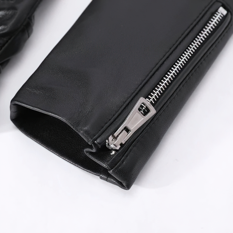 Close-up of the sleek zipper detail on a stylish women's sheepskin leather jacket.