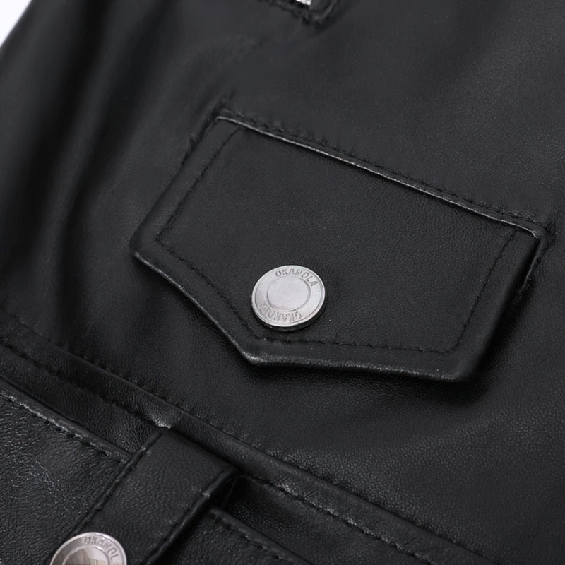 Close-up of the stylish pocket and silver snap on a women's sheepskin leather jacket, showcasing rock-inspired design.