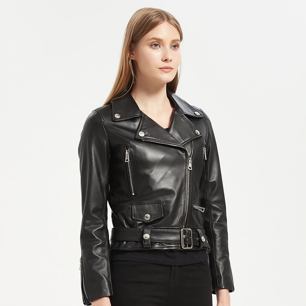 Stylish women's black sheepskin leather jacket with sashes and silver zippers for a casual rock look.