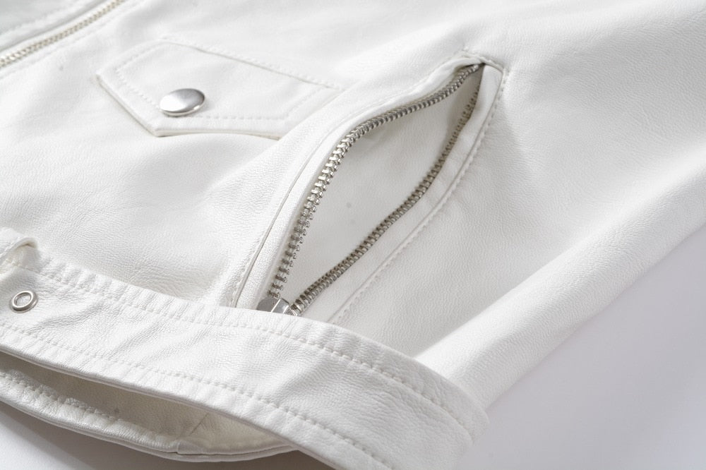 Close-up of a stylish white faux leather jacket featuring zippers and button details for alternative fashion.