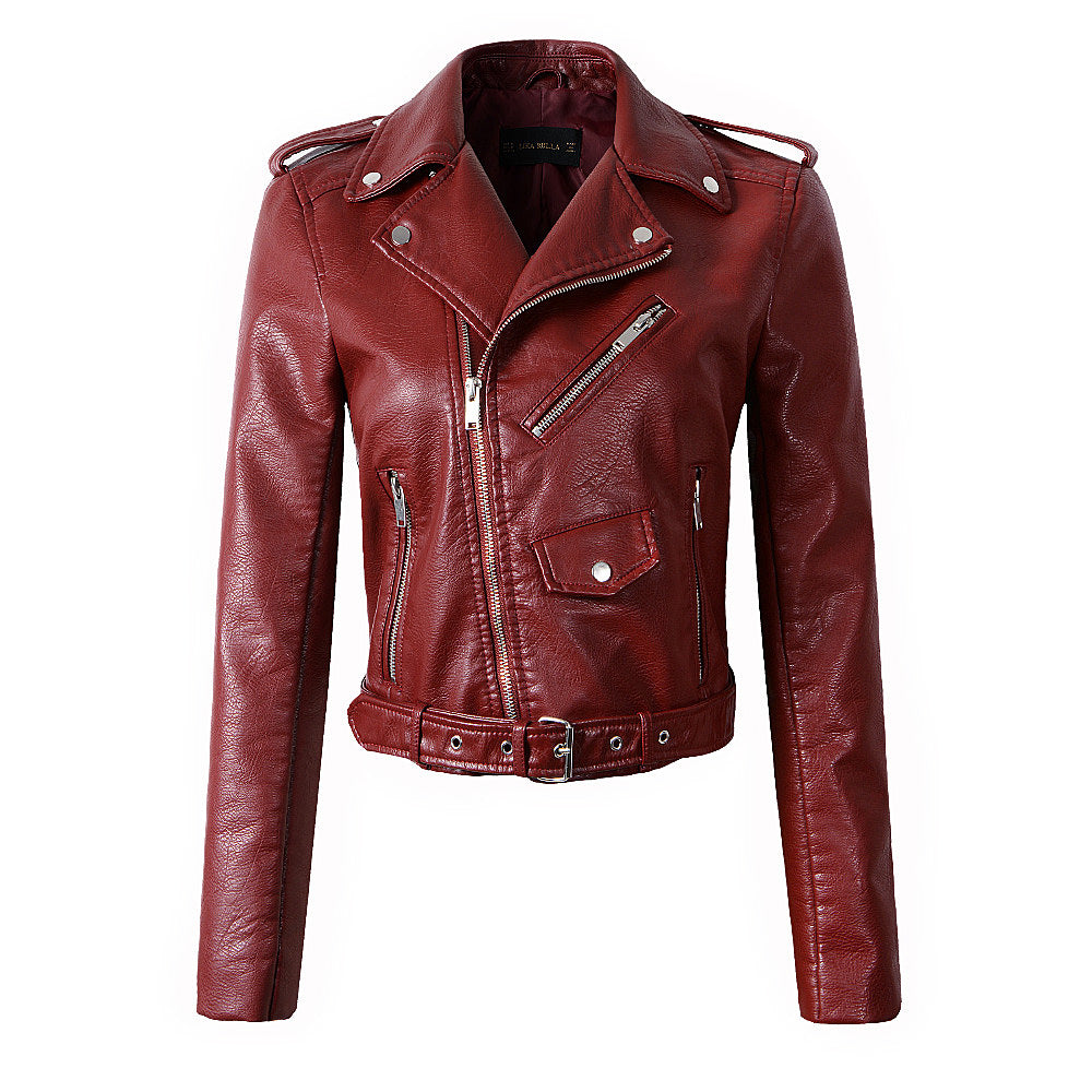 Stylish women's red faux leather biker jacket with belt, zippers, and buttons in alternative fashion.