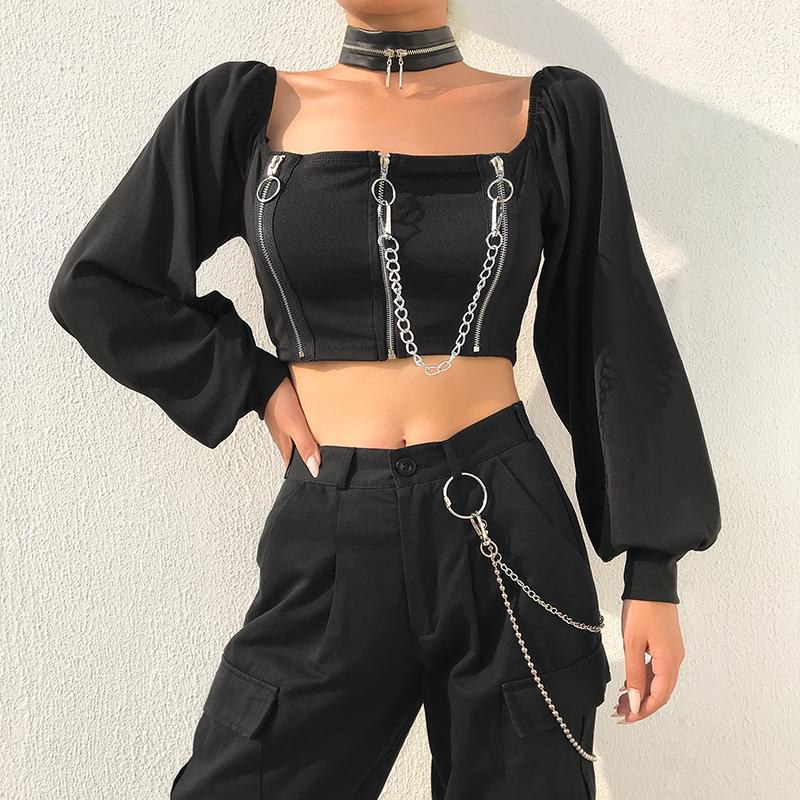 Off shoulder black top with long sleeves and zipper details, perfect for alternative rock fashion style.