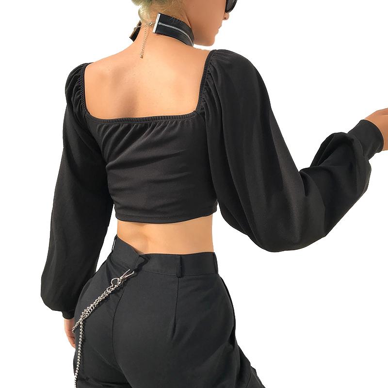 Off shoulder black long sleeve top with zippers, showcasing alternative rock fashion for women.