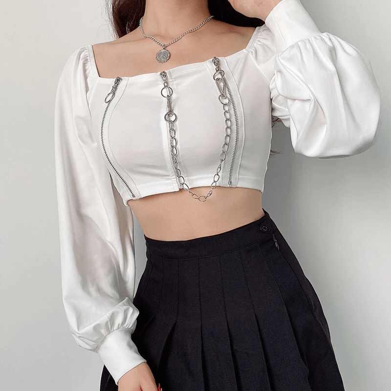 Stylish off-shoulder white top with long sleeves and zipper details, perfect for alternative rock fashion.