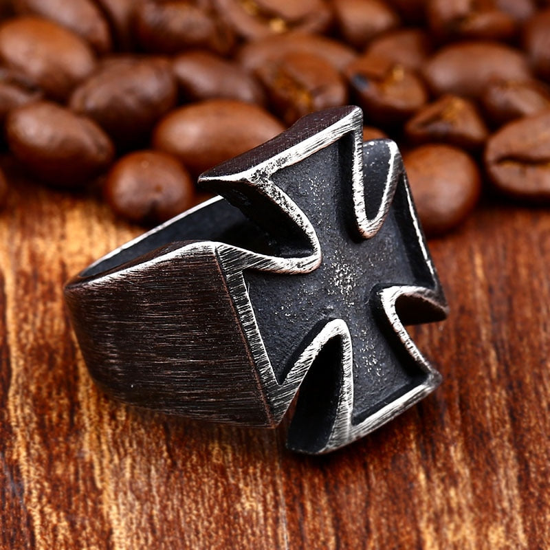 Old School Biker Iron Cross Ring on wood with coffee beans, stylish stainless steel rock accessories.