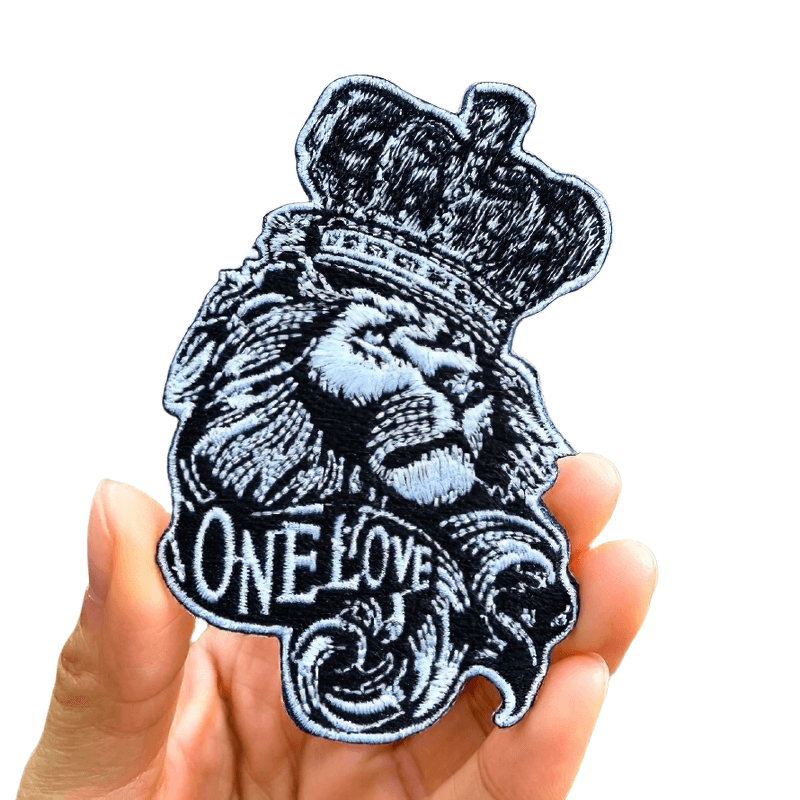 One Love lion crown iron-on patch, stylish unisex alternative fashion accessory for unique outfits.