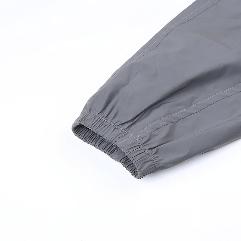 Close-up of elastic cuff of stylish gray outerwear, showcasing modern design and comfortable fit.