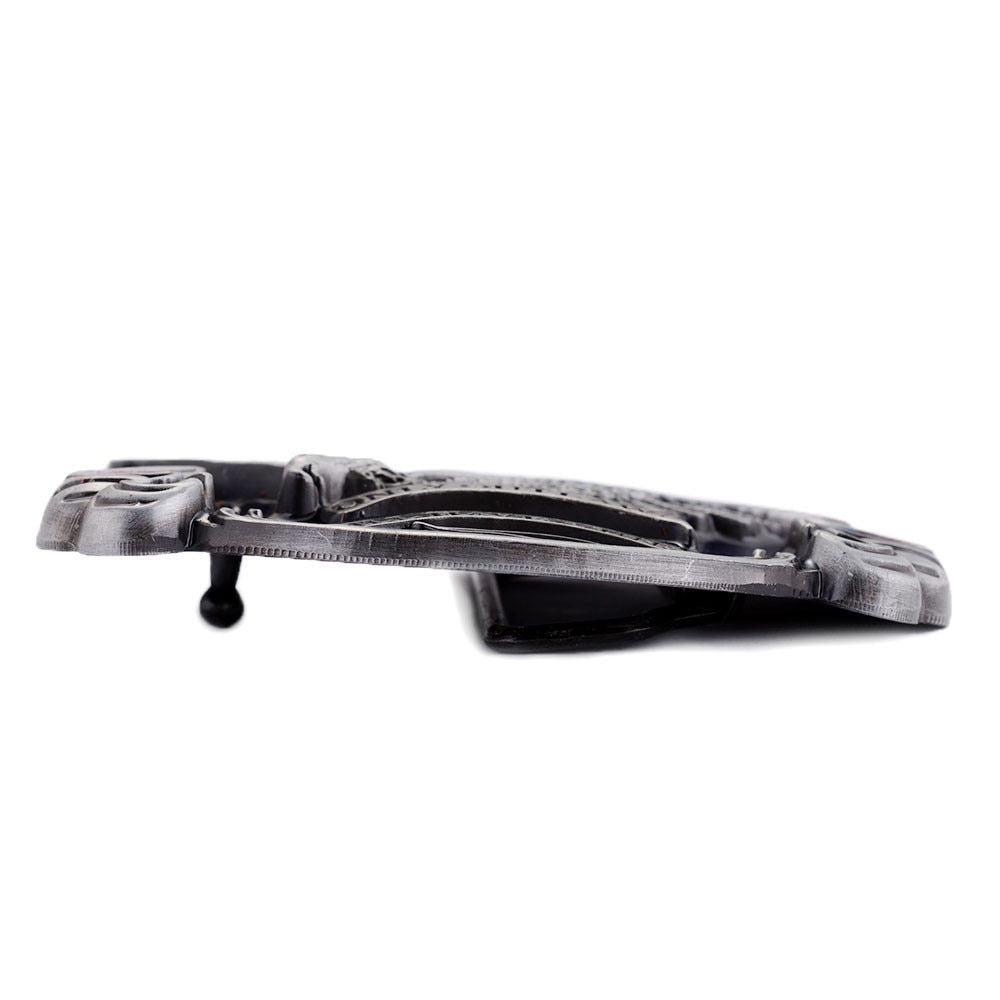 Side view of a sleek metal belt buckle with an eagle design, showcasing alternative fashion style and unique detailing.