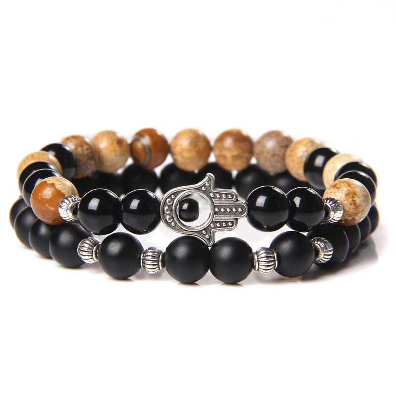 Stylish unisex onyx stone bracelet with metal hamsa charm and earthy tones, perfect casual accessory for any outfit.